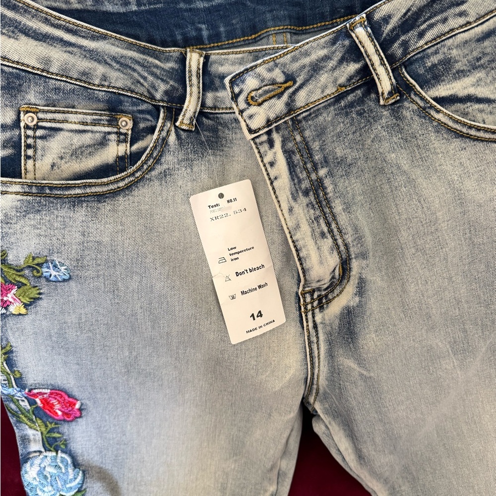 New (never worn) Embroidered Size 14 jeans by Zelle.
Meant to be hemmed.